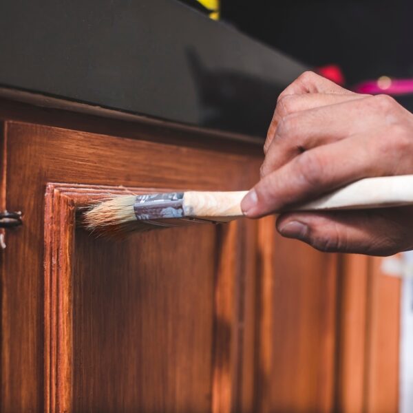 A,Handyman,Paints,A,Fresh,Coat,Of,Varnish,On,The
