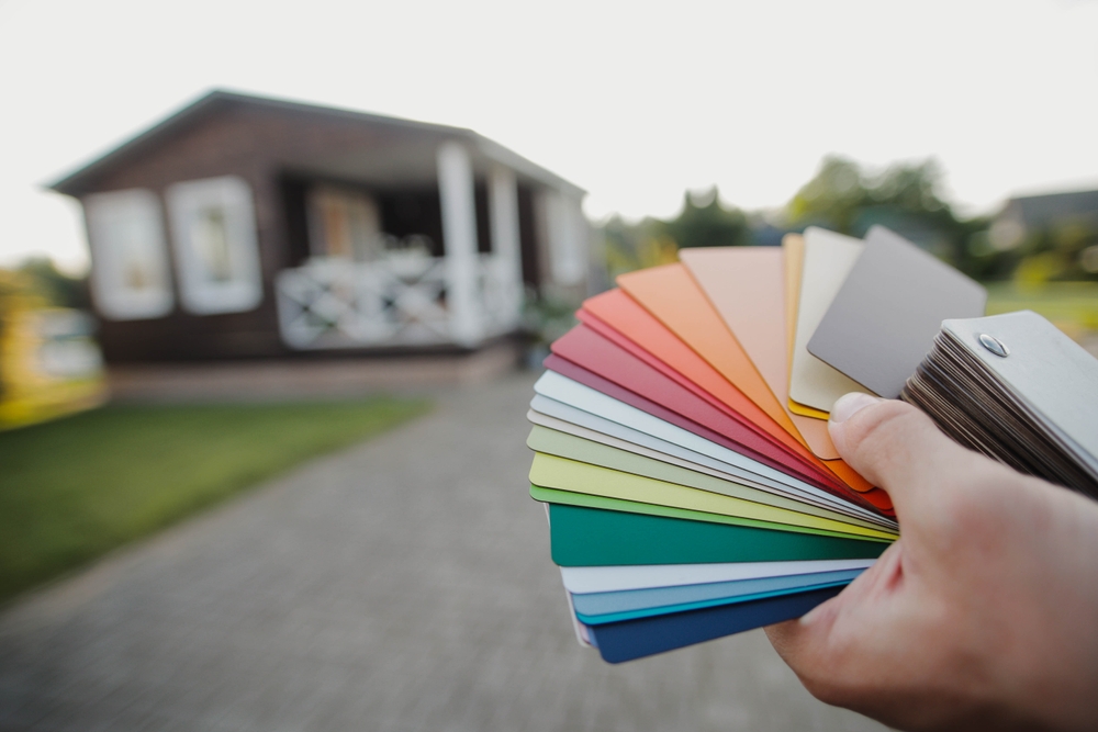 Close-up,Of,Man,Architect,Choosing,Samples,Of,House,Exterior,Paint.
